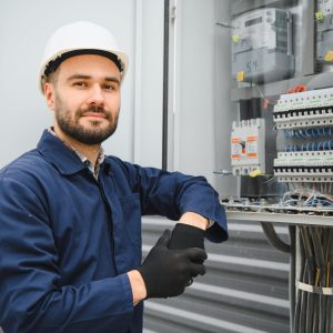 Electrical engineer approving power distribution box installation on site Electrical engineer approving power distribution box installation on site.